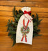 A lovely pair of seasonal flour sack towels. The design is a pair of red skis intermixed in a pinecone wreath. A festive way to dress up your home!  Two hand folded flour sack towels tied with a matching bow and hang tag 100% cotton, 30"x30"
