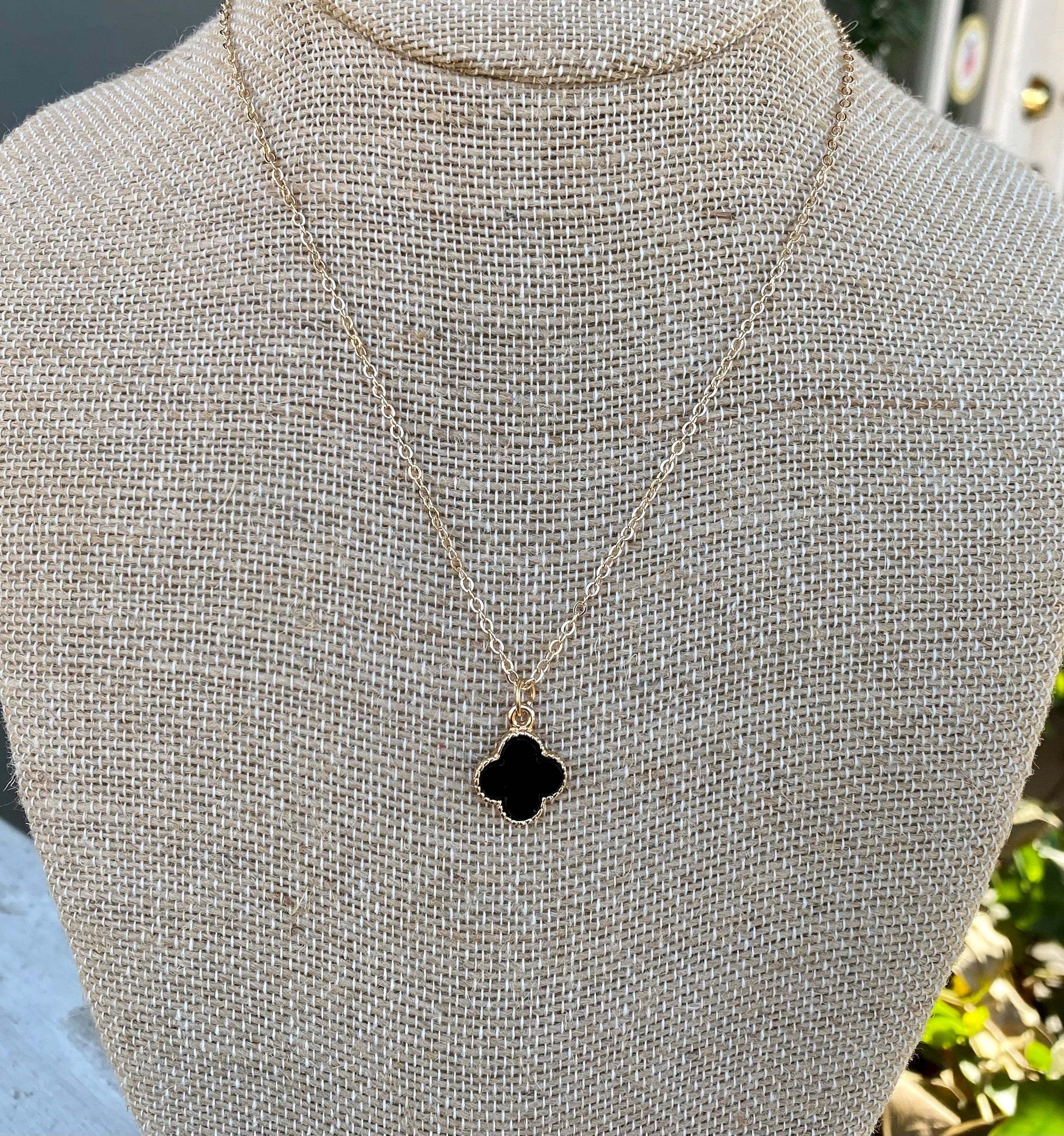 These are beautiful gold necklace with colored clover-shaped pendants. The gold chain is dainty and the pendant is trimmed in gold. Such a sweet necklace!  Length is approximately 18-21"