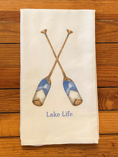 The perfect hostess gift when you visit your lake friends! Accented in the lake color of blue, this tea towel is sweet and simple with blue and brown oars. All of your lake friends will love this!  Details:   ​100% Cotton Dimensions 20x25 inch