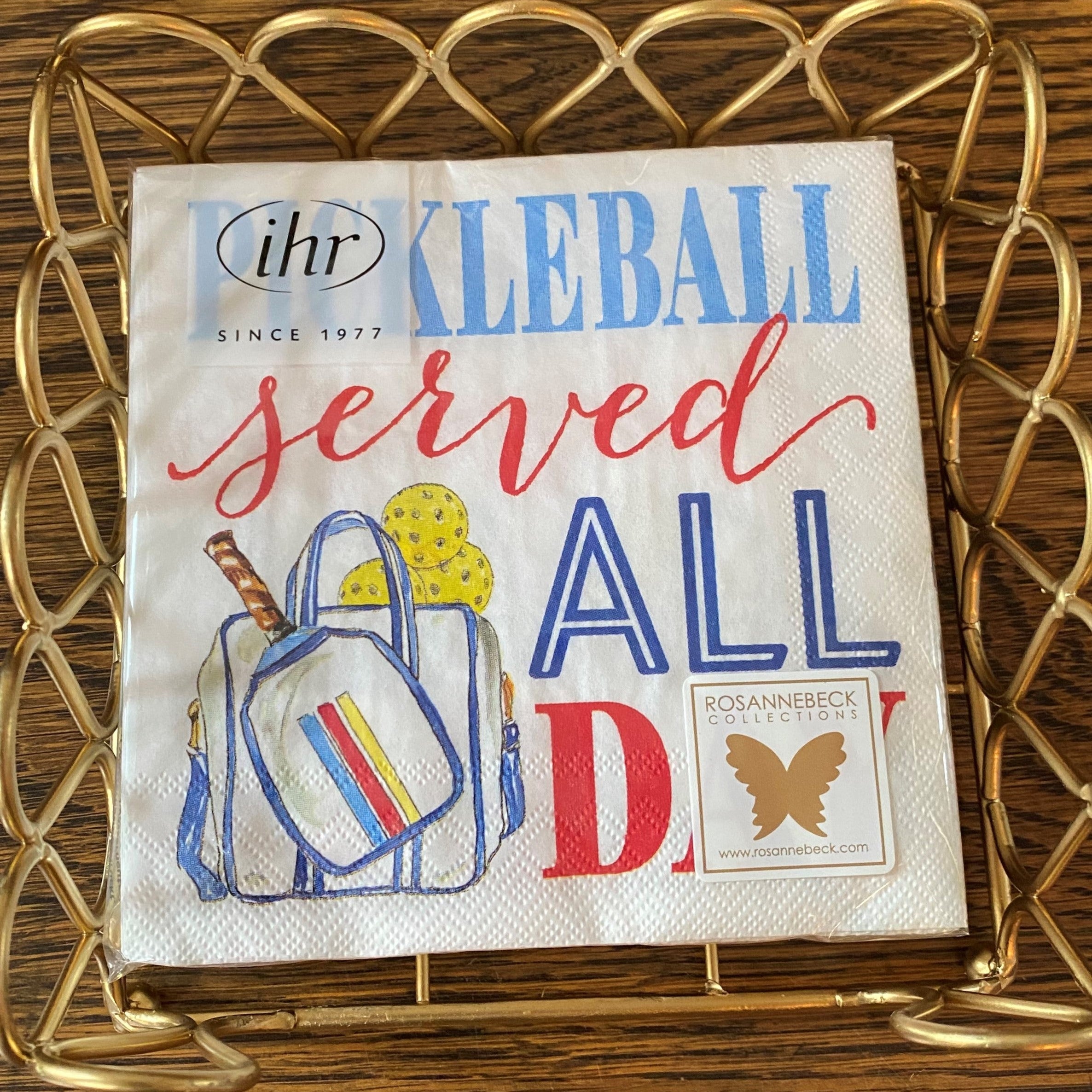 Pickleball themed cocktail napkins in red, blue and yellow.