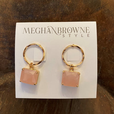 These elegant gold circle & quartz earrings feature a delicate circle post adorned with a square pink quartz drop. This is the perfect accessory for any special occasion.