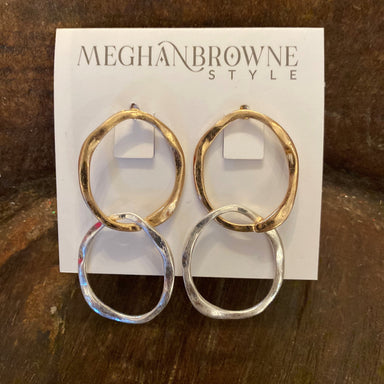 These Double Hammered Circle Post Earrings provide the perfect balance of style and versatility. Crafted with one gold and one silver circle, they can be worn in both casual and dressy ensembles. The double-hammered finish gives them an edgy look that stands out.