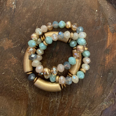 This set of three bracelets features light colored beads and crystal accents with gold hardware. The stretch construction ensures a comfortable fit and makes them easy to put on and take off. 