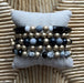 Five Strand Bracelet Set: You will love this versatile beaded bracelet set! You can combine the five in different combinations making it look like you have a new bracelet each wear. The set is stretch so very easy to wear!  It includes the following strands:  two gold strands, one black gray and gold, one black tube gray gold and white, one with black crystal gold gray crystal and black & white beads