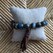 Blue & Brown Bracelet with Leather Tassel: This is a beautiful bracelet with earth tones beads in blue and brown - such a lovely combination. The bracelet is a stretch bracelet with a leather tassel.