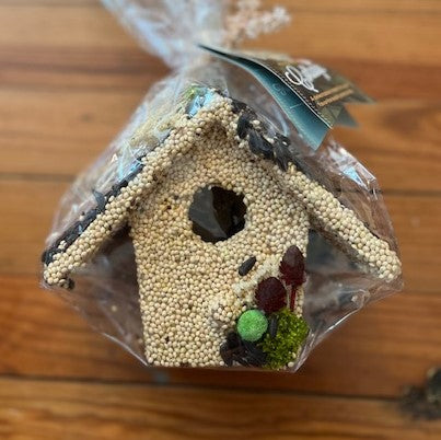 Absolutely the perfect gift for the bird lover or just the hard to shop for! These adorable seed covered bird houses will thrill your feathered friends, and the nature lovers your life.   Hand decorated with natural raffia, floral, cranberries, raisins, and millet.  Under the seed and decoration is a small ornamental wooden bird house.  Approximately 6″ tall.  Comes wrapped in cellophane with a to/from gift card. 