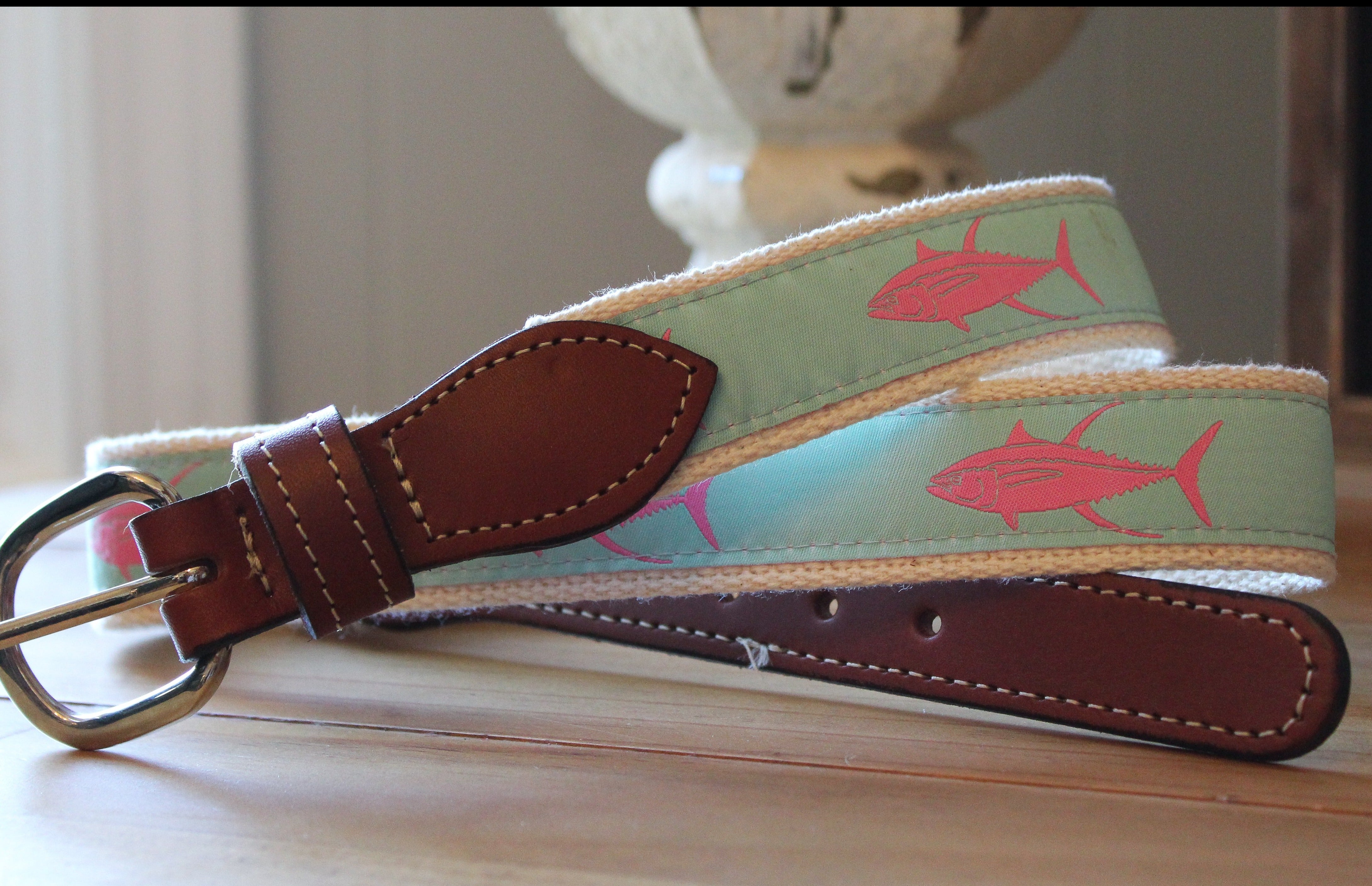 Light blue background with pink Tuna Ribbon Webbed Leather Belts
