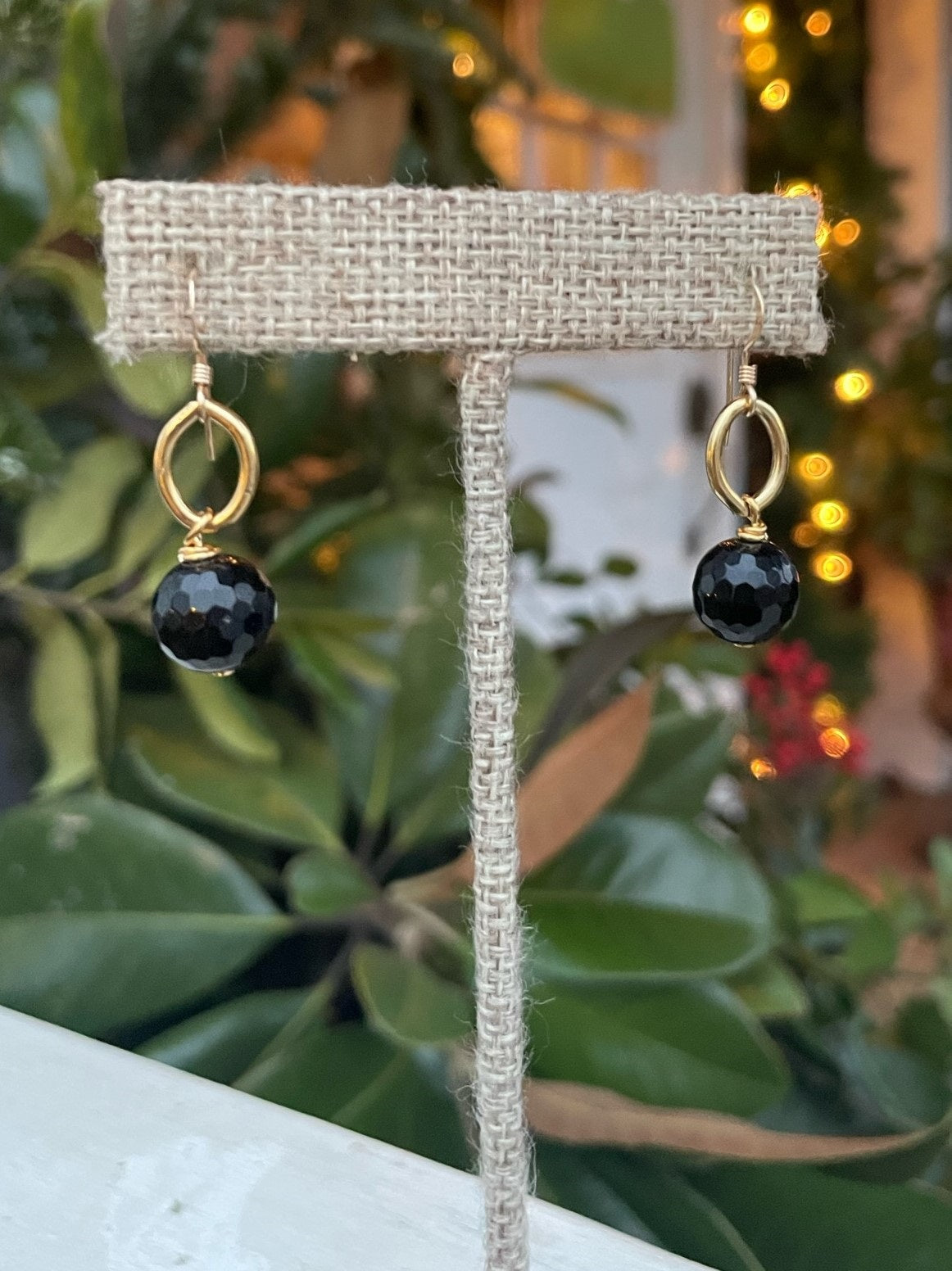 These single bead earrings are just the right touch when you need a little color, but a smaller earring! They have gold hardware and have a open circle above the colored bead. A simple but lovely pair of earrings!