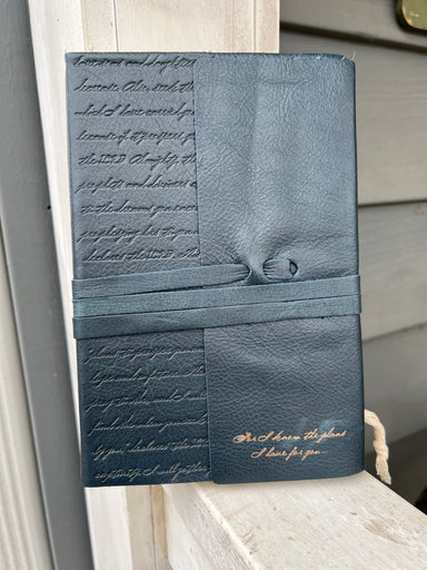 You will love journaling in this beautiful navy leather journal!  Full-Grain Leather  Navy Leather  Heat Debossed and Gold Foiled Text  Leather Strap Closure  Ribbon Marker  400 Lined Pages  Scripture Verse on Page Spread  Canvas Bag Included for Storage  Packaged in Heavy Duty Cardboard Gift Box Refer to Leather Care Guide for Maintenance  Size: 8.5" x 6” x 0.9" (210mm x 152mm x 23mm)
