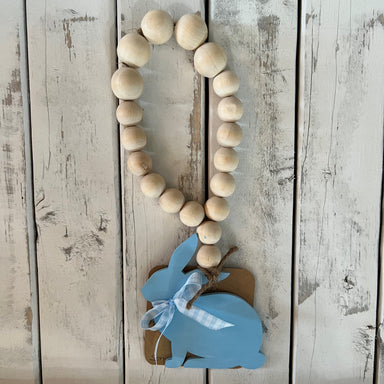 Enhance your baby's nursery with this charming door knob hanger featuring a bunny, carousel horse, and hot air balloon. Ideal for adding a unique touch of style to any room, this décor is sure to make your little one smile.