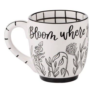 This hand-painted jumbo mug is not only beautiful to look at, but it also holds an inspiring message: Bloom Where You Are Planted! With a capacity of 16 oz, this mug is great for indulging in your favorite hot beverage and its accompanying box makes it an easy gift for a friend. Live in the present and bloom!  Care Instructions: Hand wash Only/ Do Not Microwave