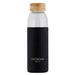 Glass water bottle with black silicone koozie that reads Just Believe