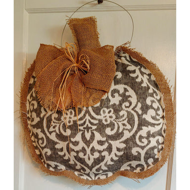 This grey and white fabric and burlap pumpkin shaped doorhanger is made right here in Peachtree Corners by local textile artist, Allison Wright.  