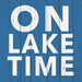 Blue napkin with white block text On Lake Time
