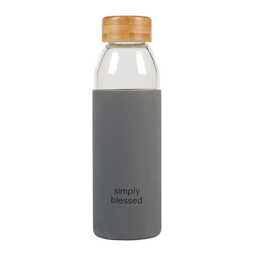 Glass water bottle with grey silicone koozie that reads Simply Blessed