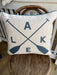 Square Pillow with Lake and Oars in gray text with blue piping