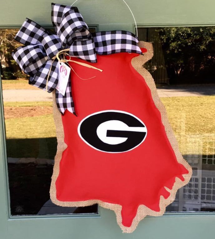 This state of Georgia shaped Doorhanger with a Georgia G and a black and white checked bow is made right here in Peachtree Corners by local textile artist, Allison Wright and will shout loud and proud about your love of the Dawgs! 