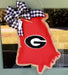 This state of Georgia shaped Doorhanger with a Georgia G and a black and white checked bow is made right here in Peachtree Corners by local textile artist, Allison Wright and will shout loud and proud about your love of the Dawgs! 