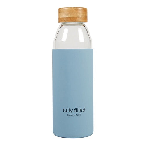 Glass water bottle with light blue silicone koozie that reads Fully Filled
